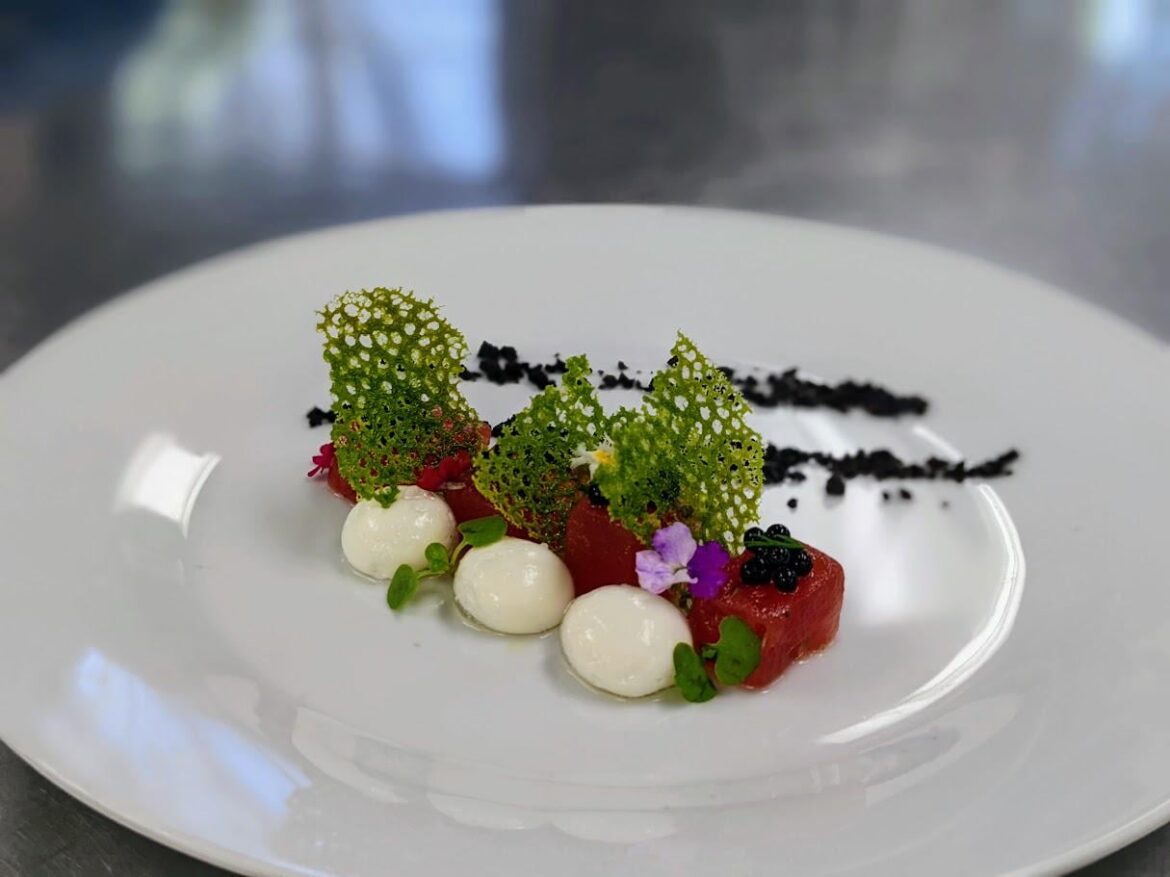 Compressed watermelon, feta spheres, basil tuille, balsamic "caviar", and dried mushroom crumble
