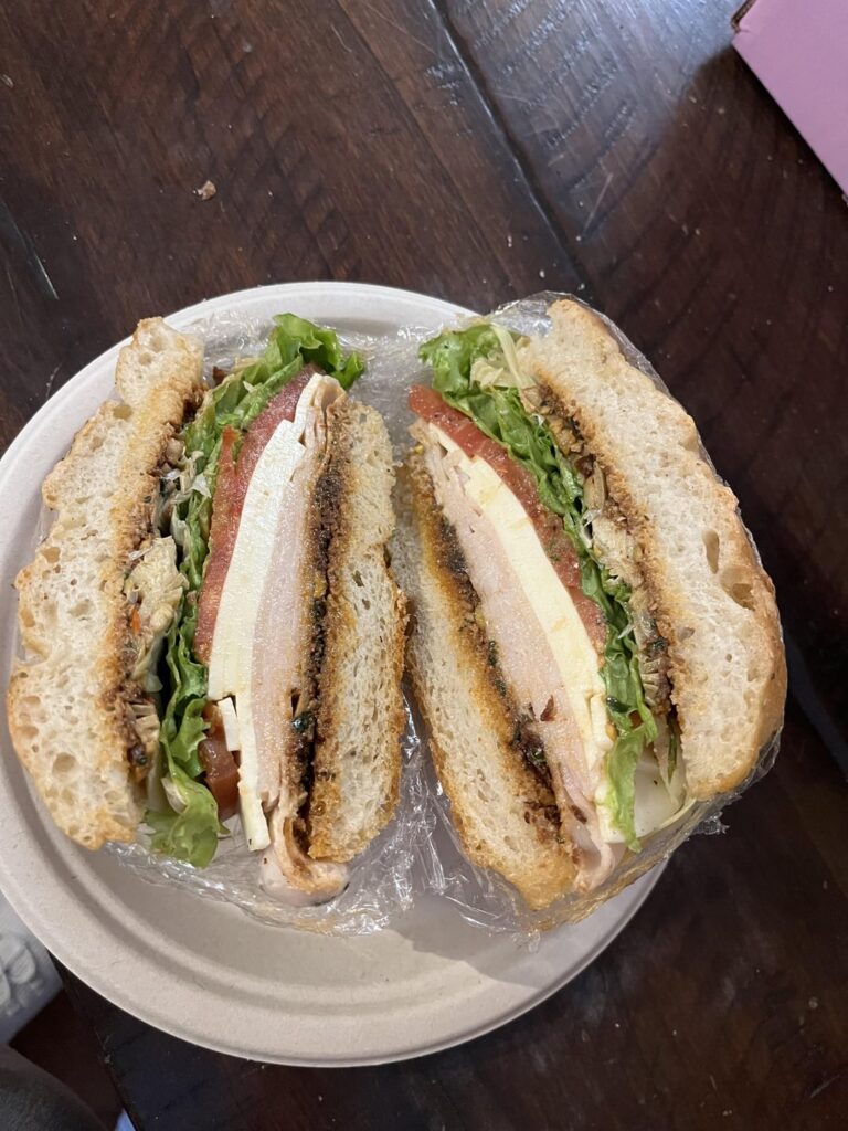 Turkey, provolone, lettuce, tomato, artichoke with homemade red pesto. On my first ever focaccia!