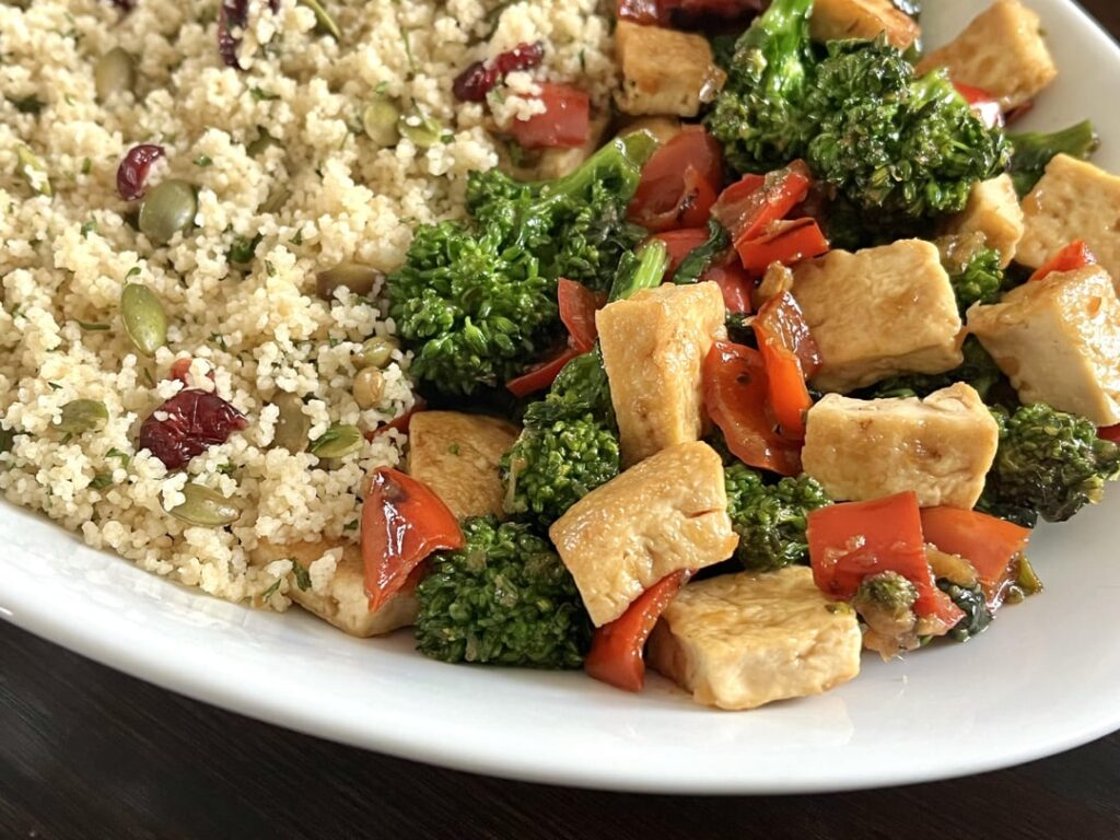 Herbed Couscous served with garlicky Tofu and sautéed veggies.