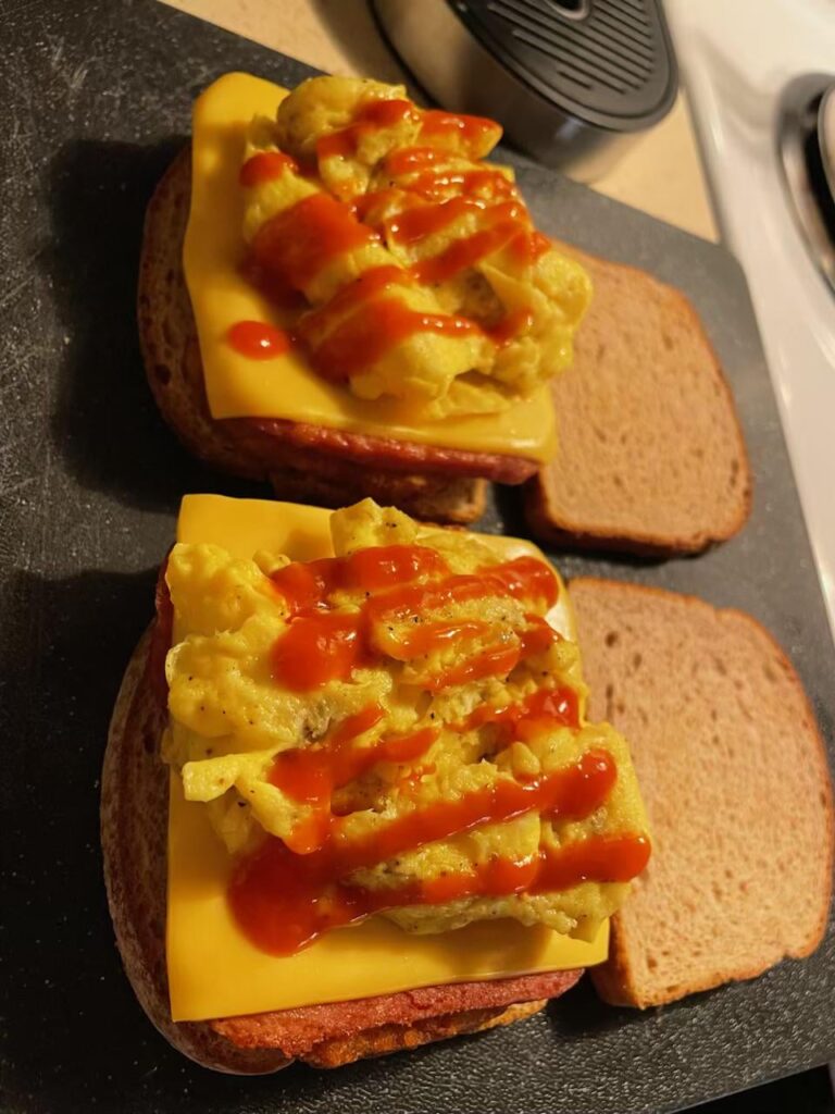 Turkey spam, egg & cheese w/ hash brown and blue agave sriracha on Dave’s killer white this morning 🌞