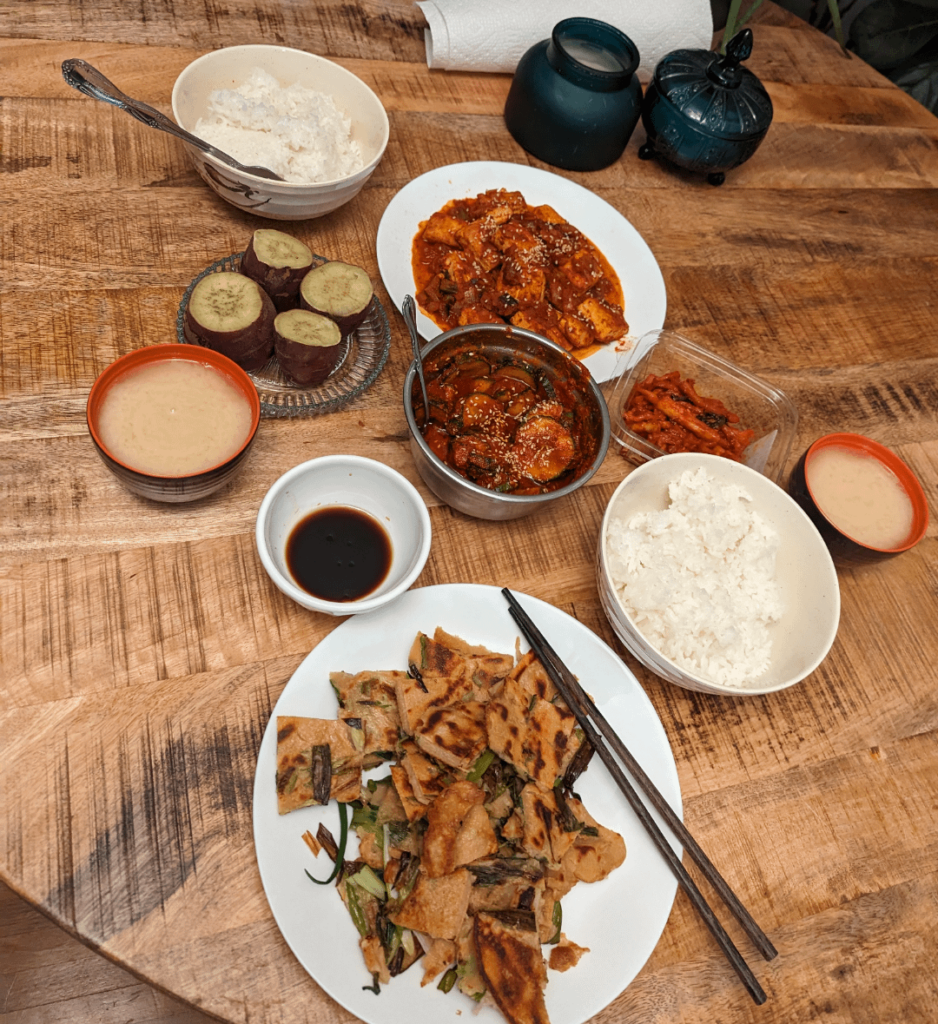 Pajeon, steamed sweet potato, dubu jorim, cucumber kimchi, mu malengi, soybean soup