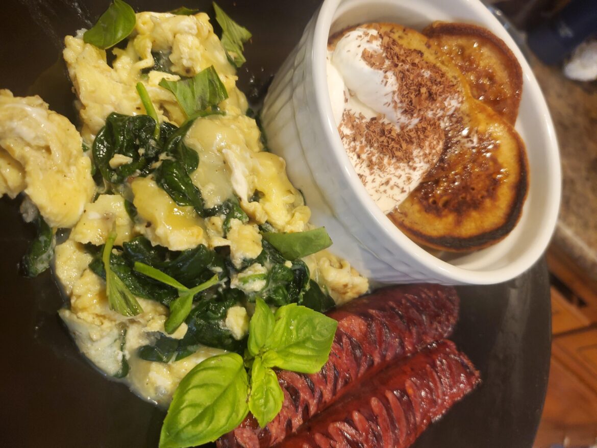 Beef sausage, soft crumble eggs w/spinach,hot cakes honey, whip cream dash dark choc