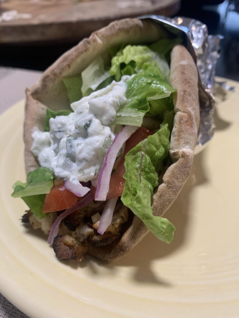 Homemade chicken gyros on an onion pita