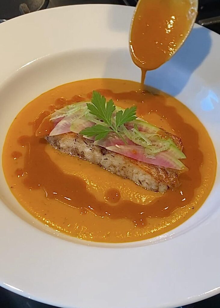 Seared sea bass, butternut and carrot velouté, shrimp, orange and harissa jus