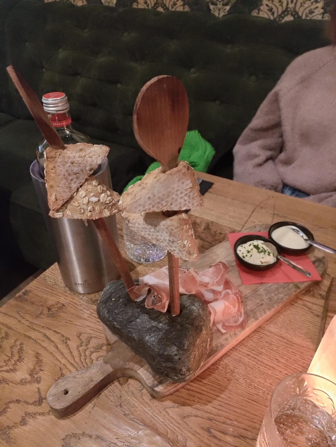 Bread on a wooden spoon.