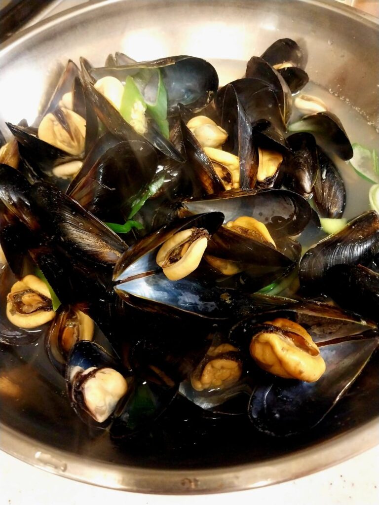 Mussel soup and fried chicken tenderloin on a snowy night