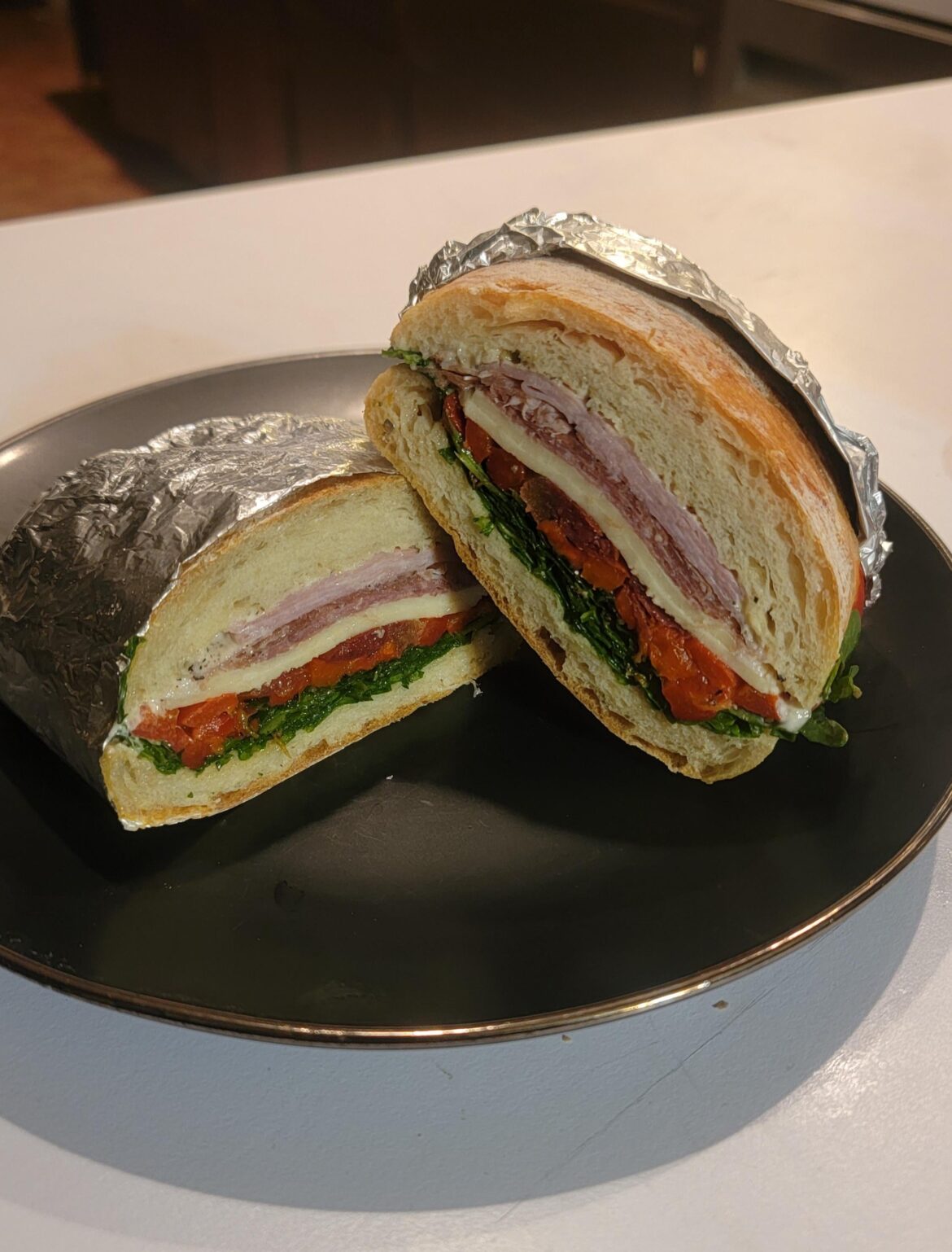 [Homemade] Salami and ham, provolone, roasted peppers, roasted tomato, chard, arugula, with horseradish mayo. On ciabatta.