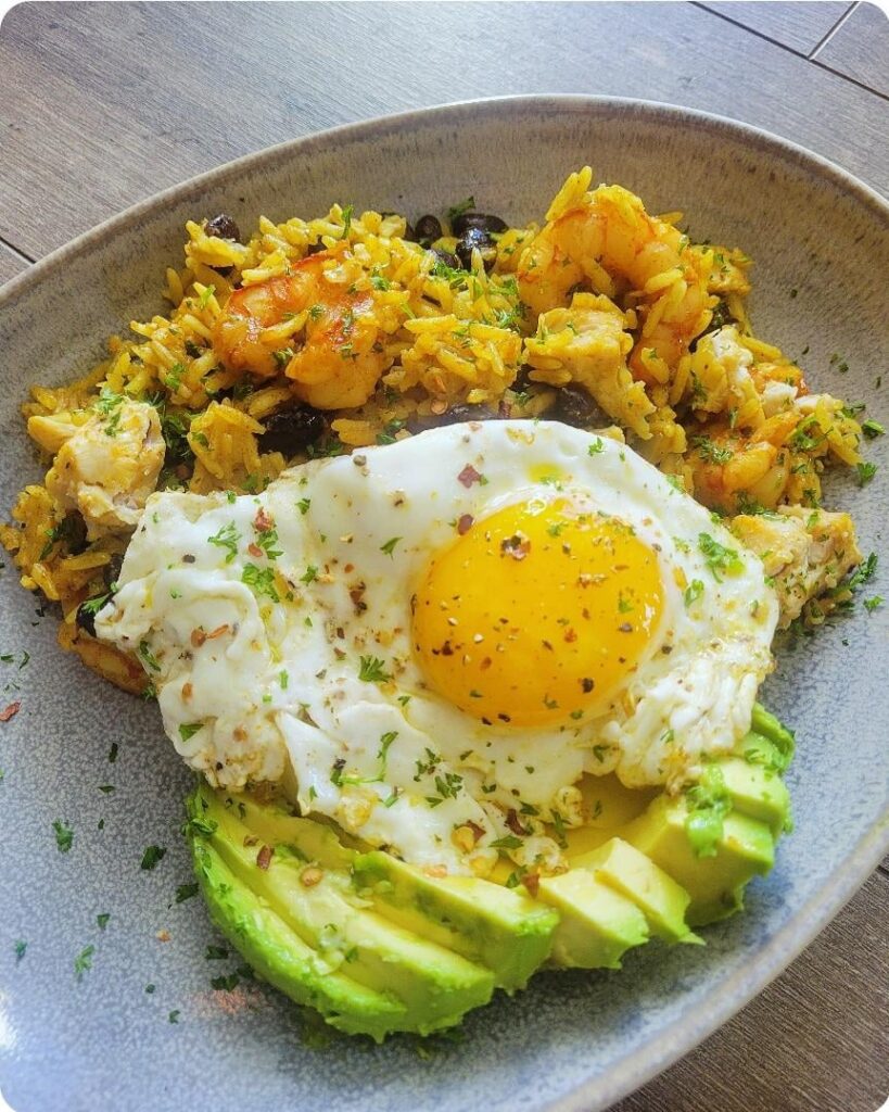 Spiced jasmine rice with black beans, shrimp, chicken, avocado, and....THE EGG.