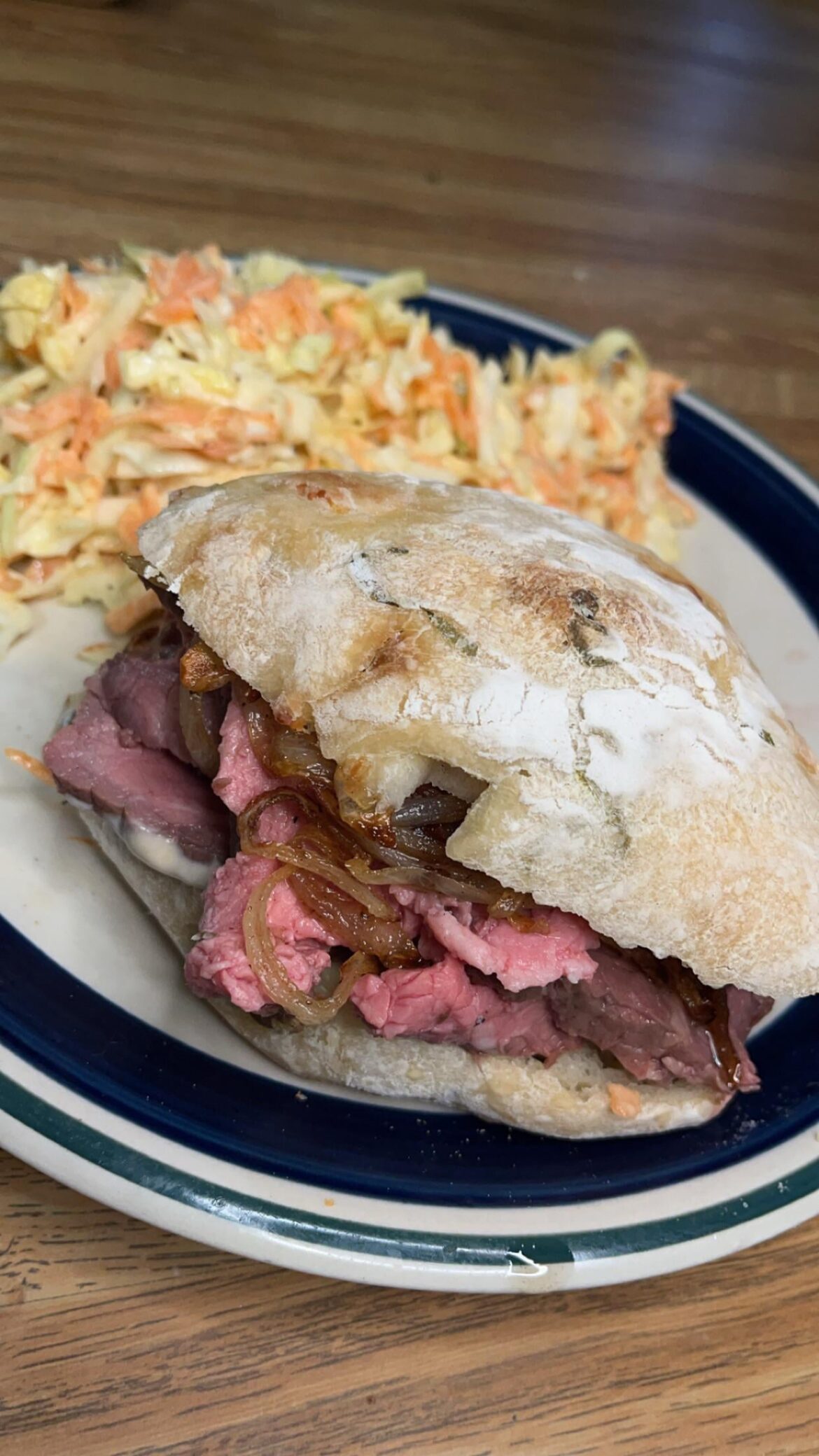 Smoked roast beef with fried onions and horseradish sauce on sourdough cheese-curd & green onion ciabatta