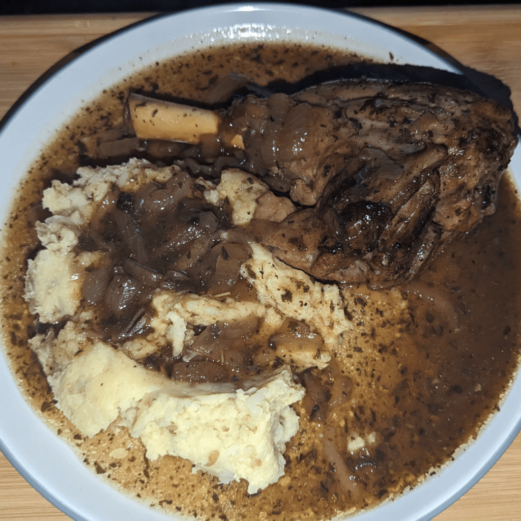 9 hour slow cooked lamb shank with garlic mash (garlic taken from the slow cooker near the end) and some of the stock the lamb was cooked in