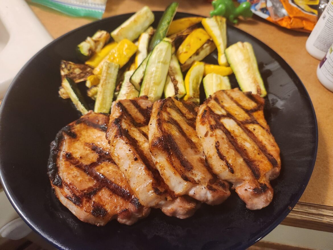 Pork chops and some zucchini and squash
