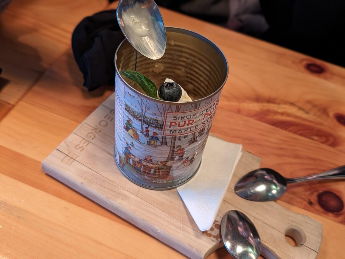 Cake in a maple syrup can on a cutting board