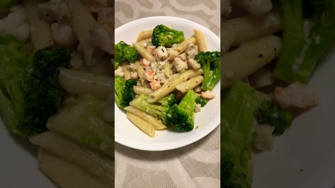 Pasta Alfredo with fish, shrimps and broccoli
