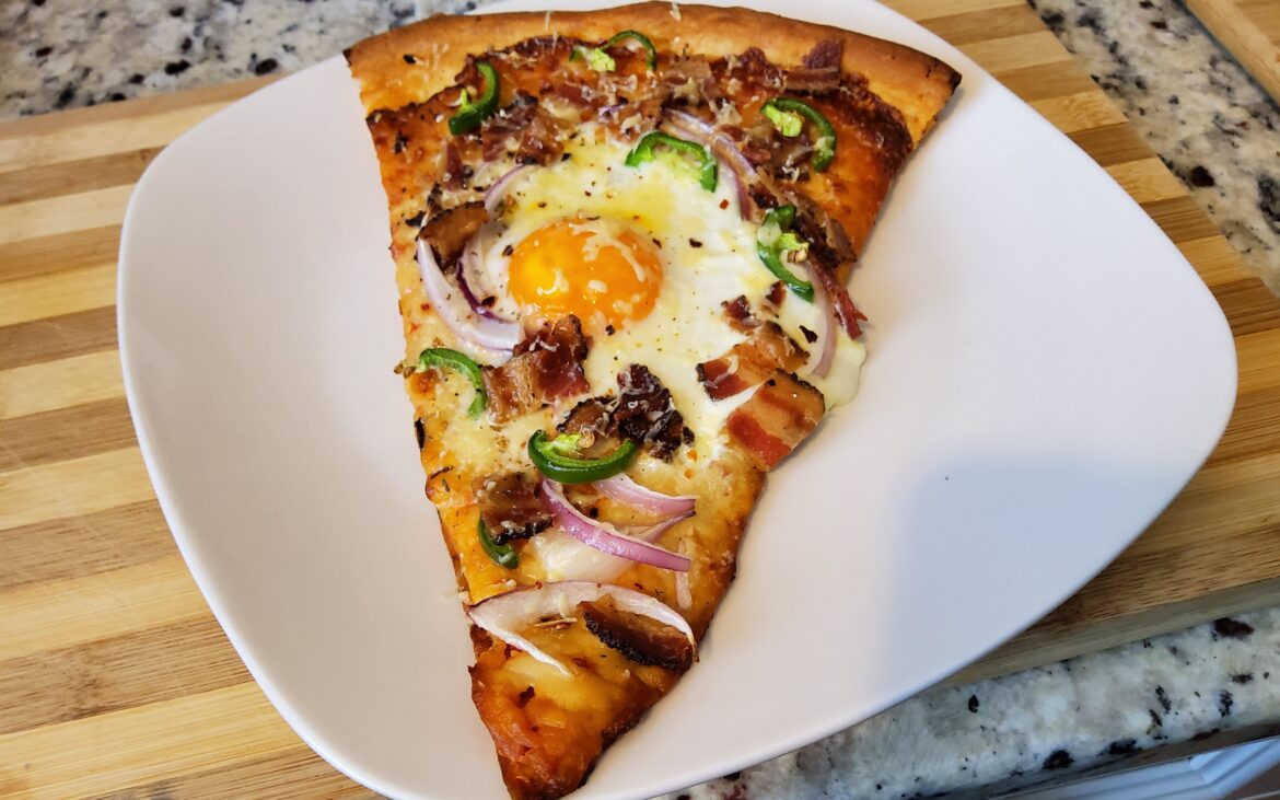 Made a breakfast out of leftover pizza with egg, bacon, jalapeno and onion.