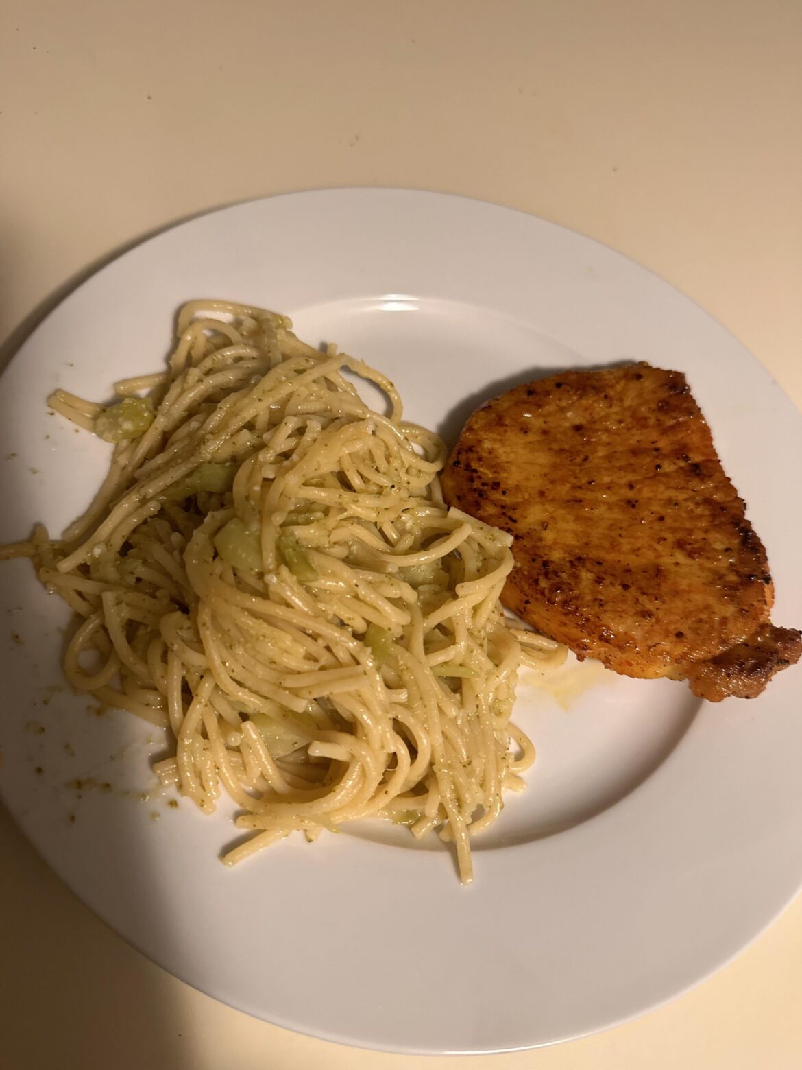 broccoli noodles with a porkchop