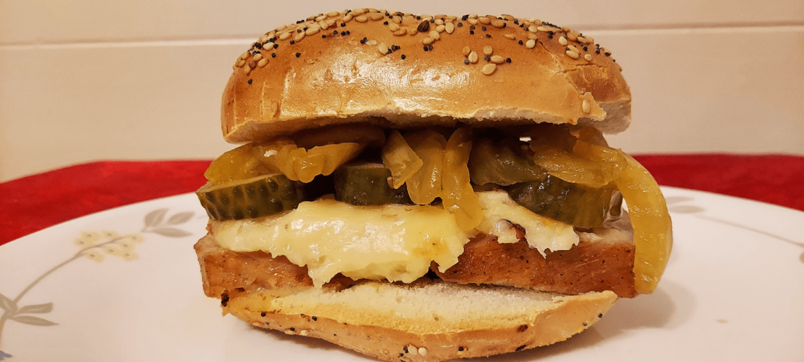 Honey BBQ pork loin, baked Bacon & Horseradish Cheddar cheese, SuckerPunch Spicy Garlic Pickles and Pickled Vidalia Onions all on a toasted everything bagel.