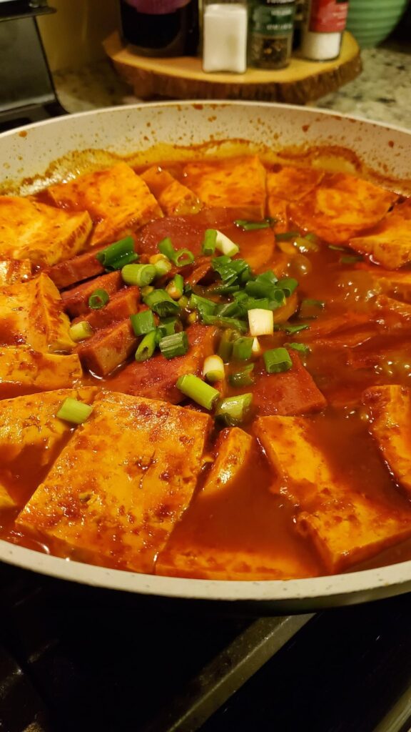 korean tofu jjageuli with potatoes and spam.