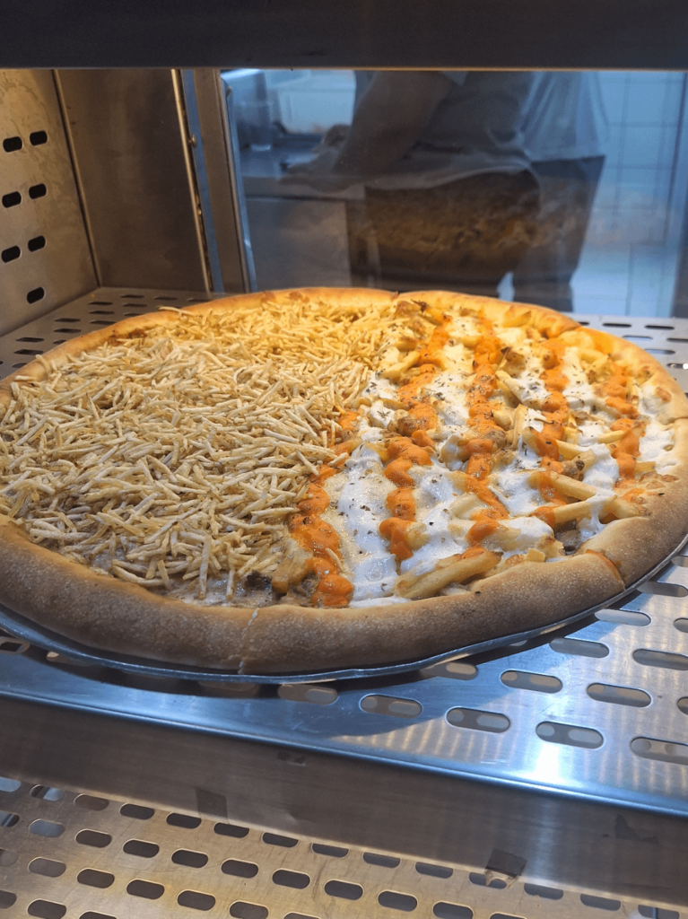 Cream cheese, Cheddar and French fries pizza! Guess the country!