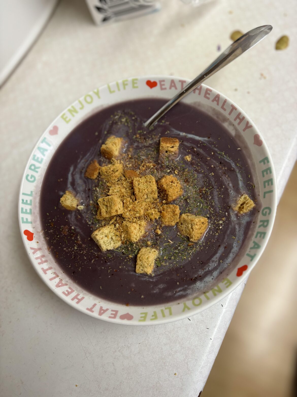 Sweet potato, ordinary potato and red cabbage soup with croutons