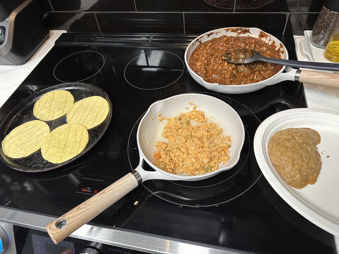 Chicken mole, Mexican rice, refried beans and corn tortillas Dining and Cooking