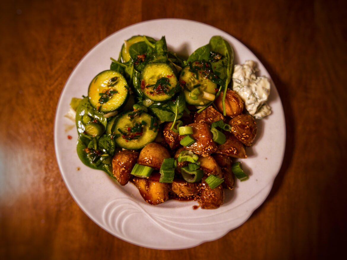 Korean glazed potatoes with spicy cucumber spinach salad