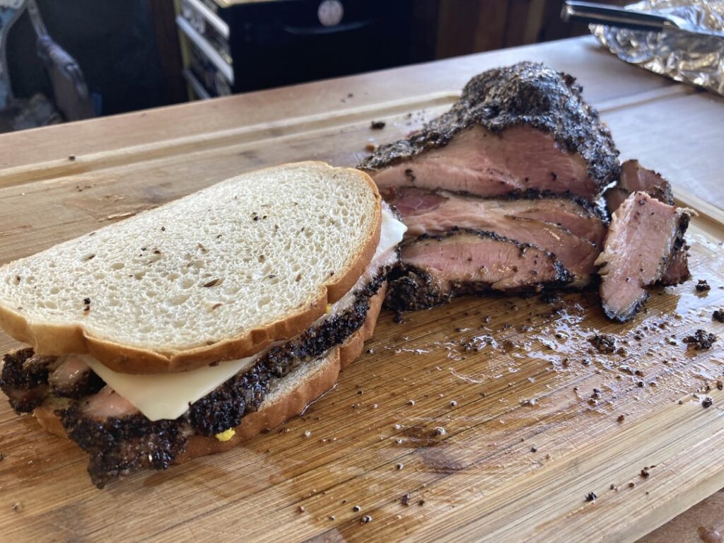 Pork brisket pastrami cooked on the WSM 22”. Brined for 5 days, smoked for 6 hours over lump coal and cherry wood. Absolutely delicious.