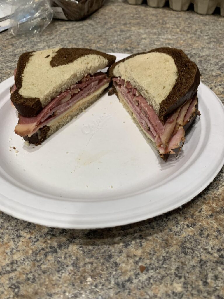 Corned Beef, Pork Pastrami, Provolone, Thousand Island, on Pumpernickel Rye