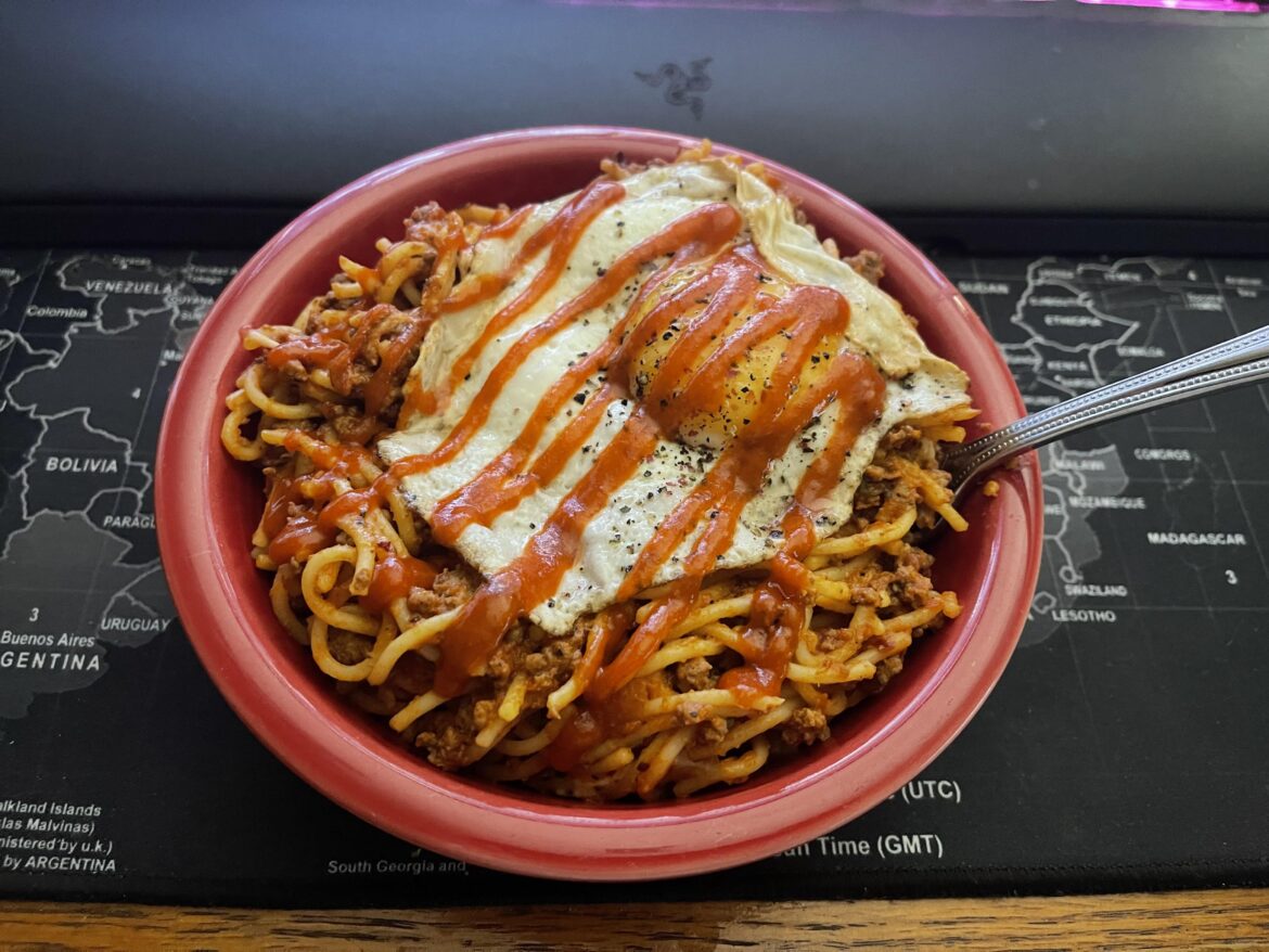 Dried habanero powder, crushed red pepper flakes and sriracha over spaeggetti