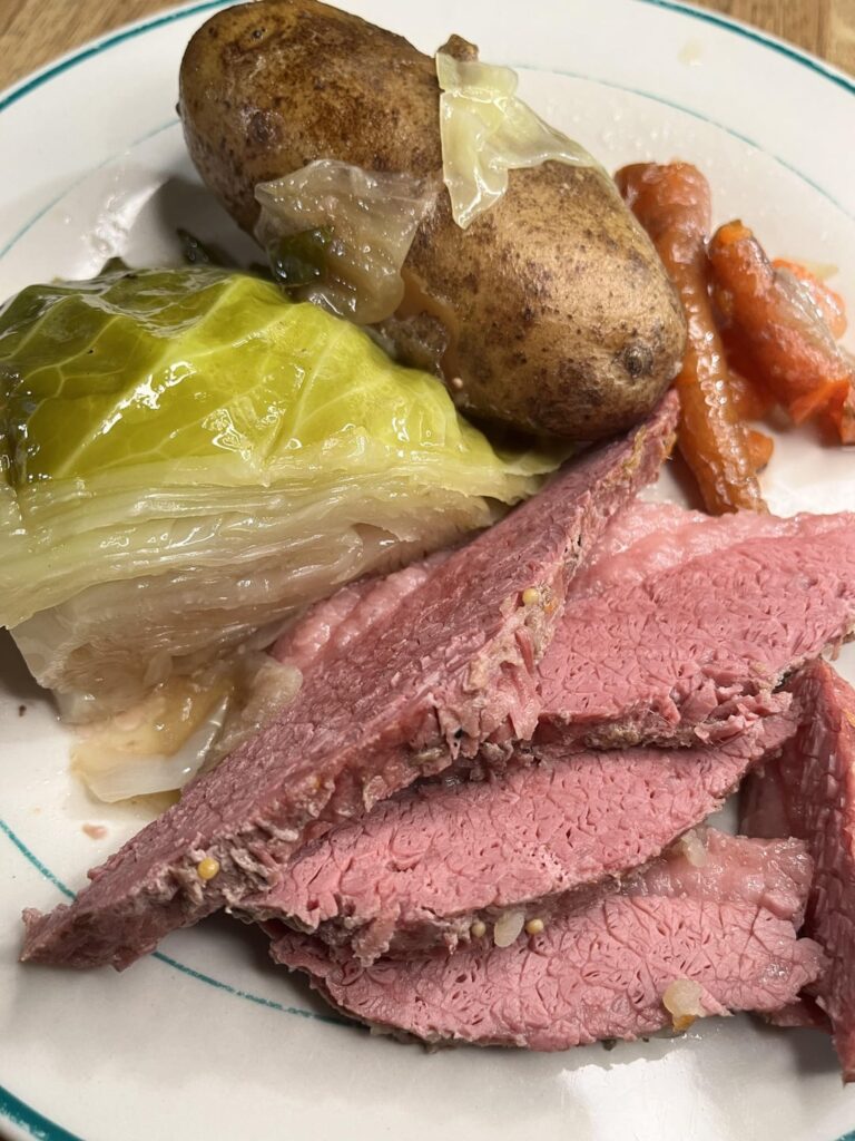 Corned beef and cabbage with carrots, potatoes, and onions