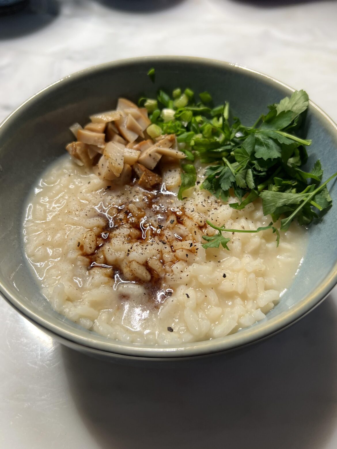 Risotto with mushroom and onion, soy sauce for garnish