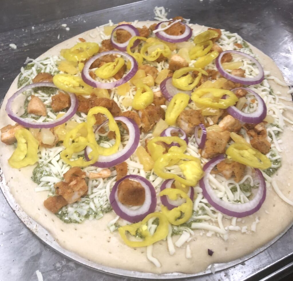 The worst pizza I’ve made in my two years of work at a pizza place. (First pic is before cooking) The worst pizza I’ve made in my two years of work at a pizza place. (First pic is before cooking)