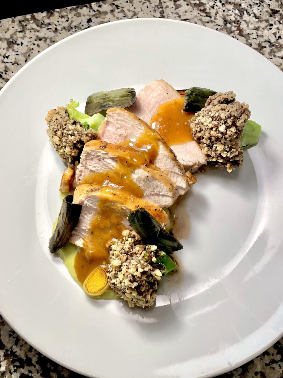 Chicken breast, leek puree, leeks, leek chips, walnut crusted broccoli, white wine pan sauce
