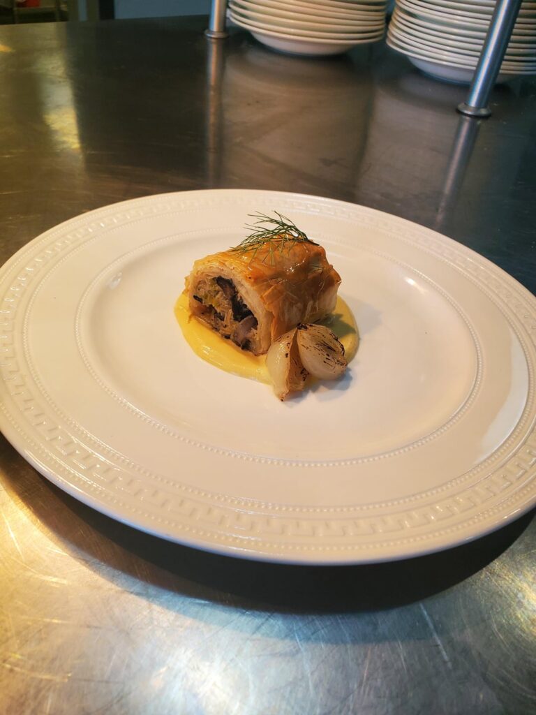 Shittaki and Leek strudel, duck fat roasted pearl onions, fennel caramel, cauliflower crema