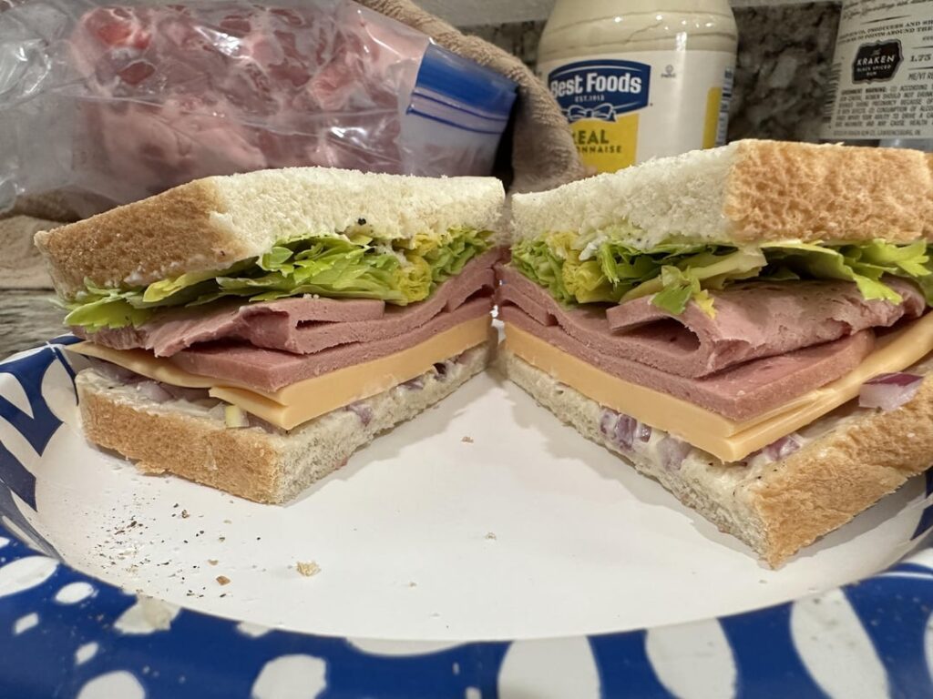 Beef bologna, kraft singles, red onion, celery leaves, mayo, & cracked black pepper on sourdough!