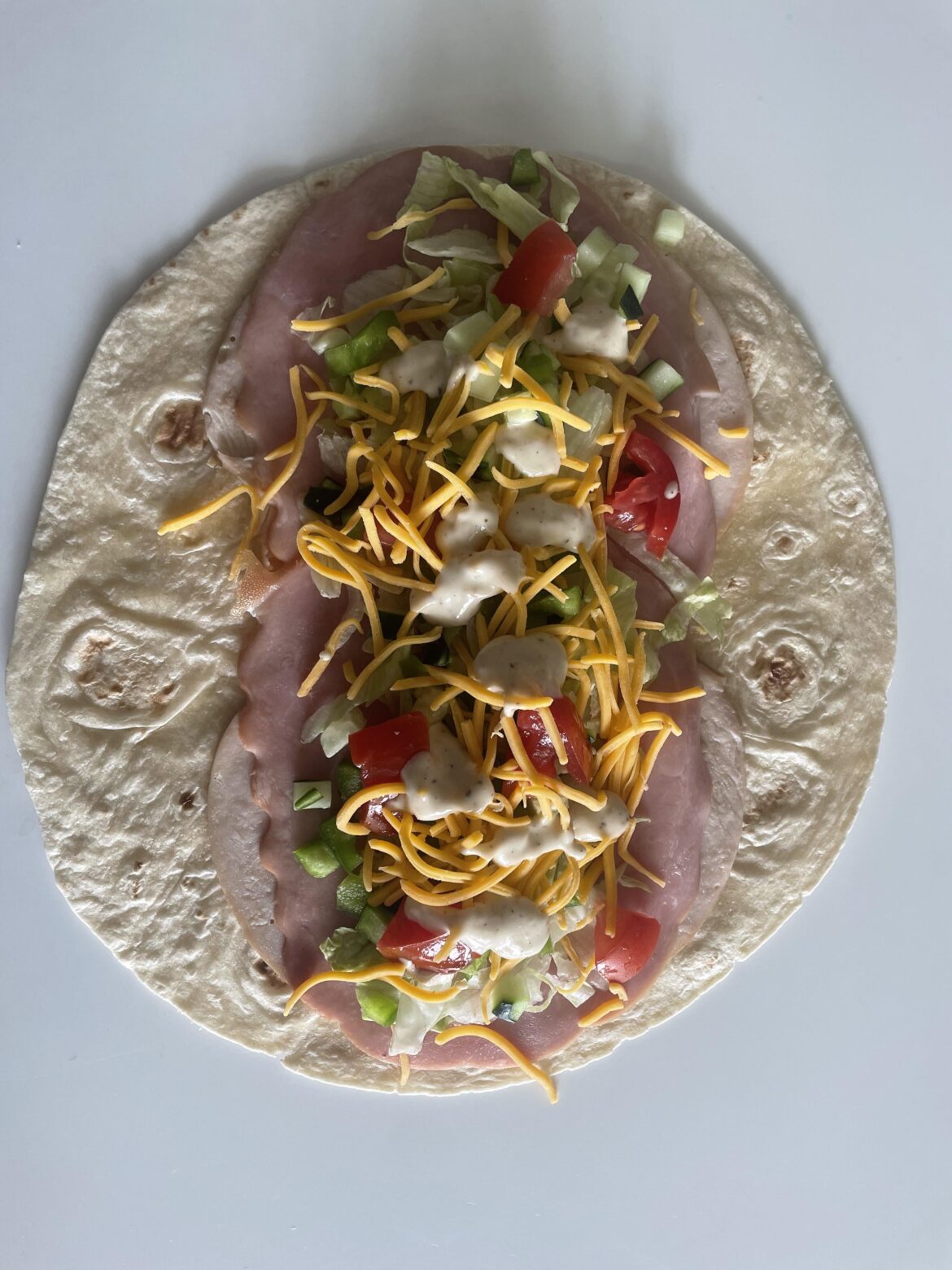 Do wraps count as a sandwich? Ham, turkey, lettuce, tomato, cucumber, green pepper, shredded cheddar, and Caesar dressing.