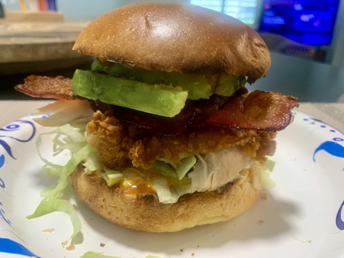 This is a spicy chicken sandwich that I made with a piece of Publix fried chicken breast, bacon, lettuce, avocado, mayo mixed with Melinda’s ghost pepper wing sauce.