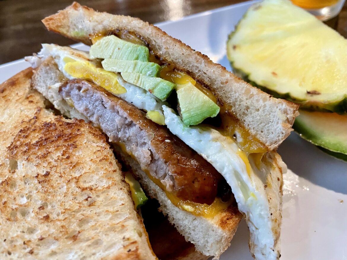 Sausage, egg, avocado, and cheddar on sourdough