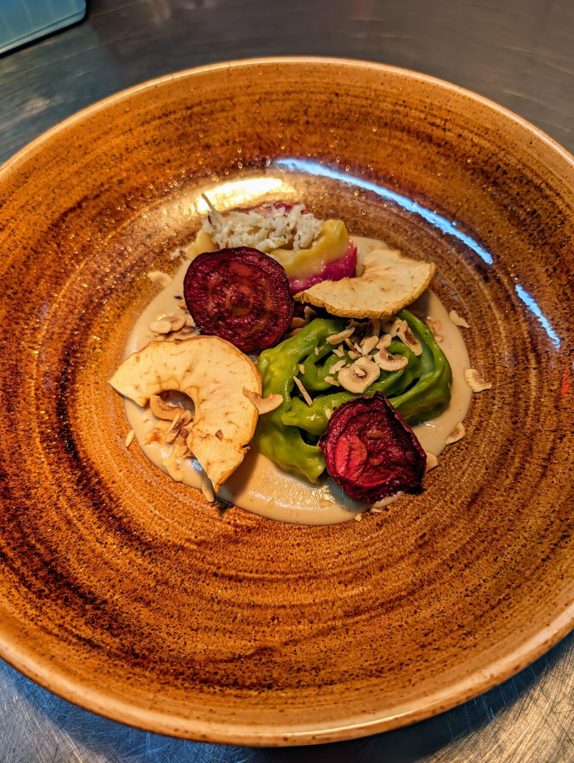 Two agnolotti "roses/crowns"