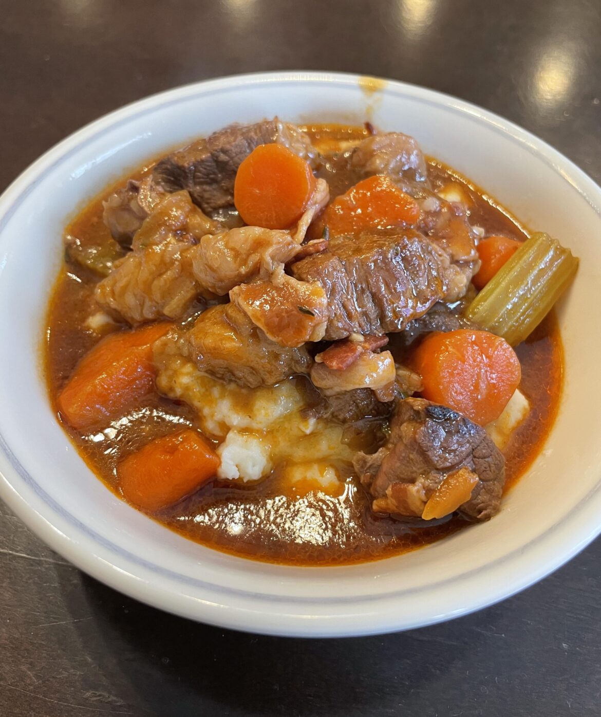 [homemade] Irish beef and Guinness stew, served over mashed potatoes.