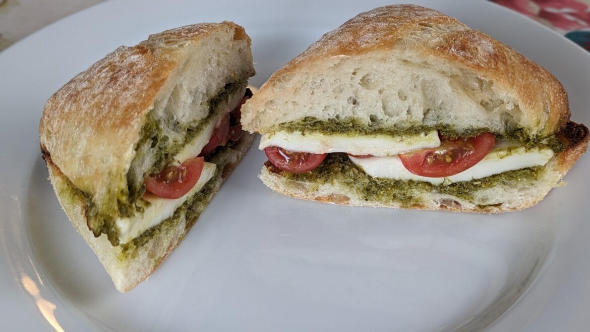 Simple and superb: fresh mozzarella, pesto, and seasoned tomatoes on toasted ciabatta