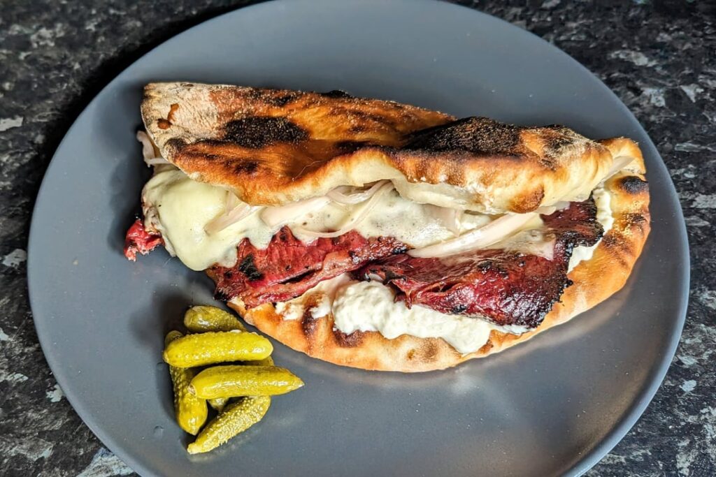 Brisket bacon, horseradish cream, pickled shallots and mozzarella flatbread