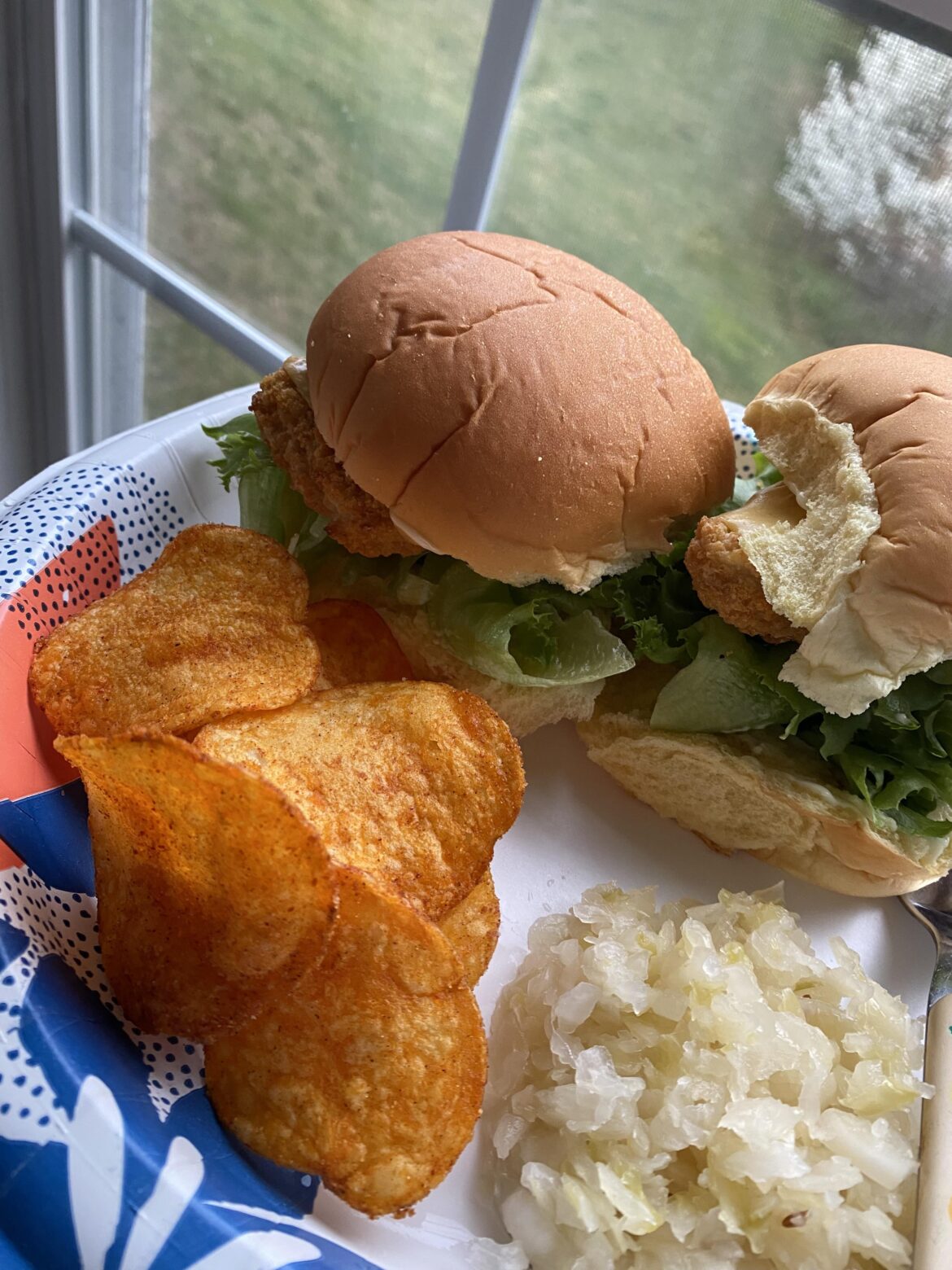 Two air fried pollock filets on potato rolls w/ locally grown lettuce, half slice American cheese and avocado oil mayonnaise. Kraut and Keogh’s Irish Whiskey BBQ chips on the side.