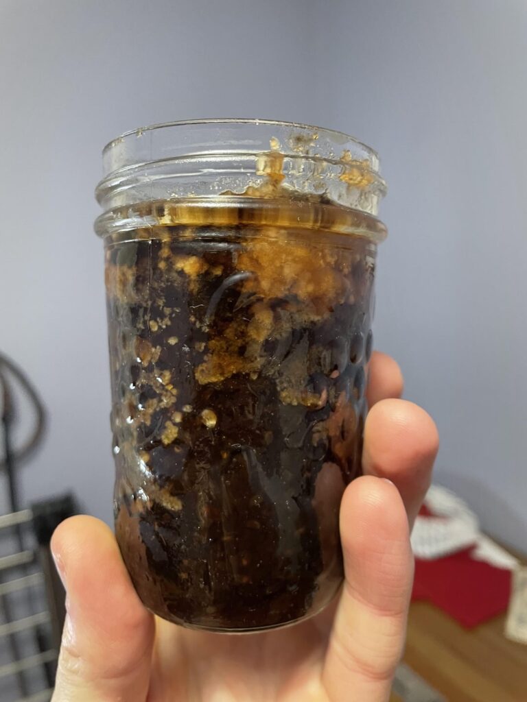 Weird white wax compound inside jam jars. Safe to eat? Weird white wax compound inside jam jars. Safe to eat?