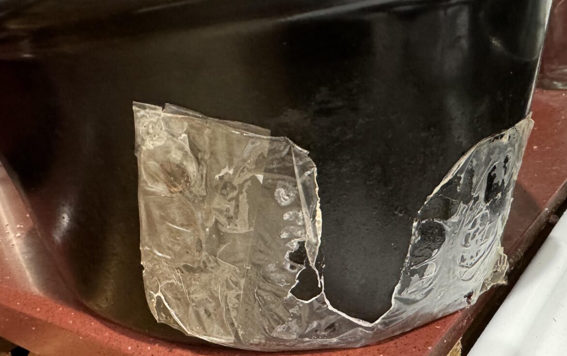 Would something like this start a fire? (Plastic stuck to side of slow cooker)