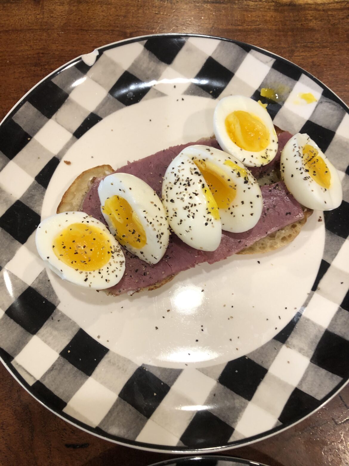 Three Eggs on Corned Beef and Muffin