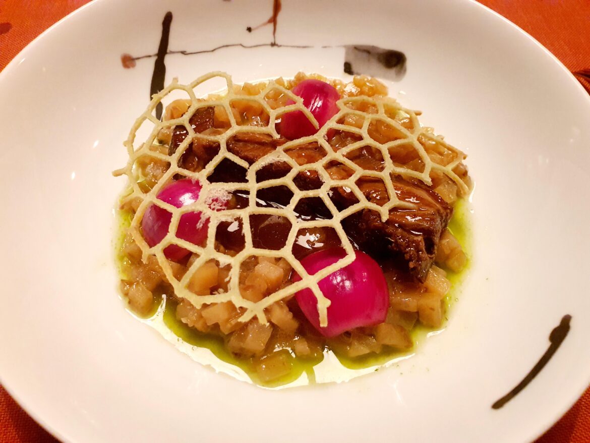 Veal cheek, baked potato & skin risotto, chive oil, pickled onions
