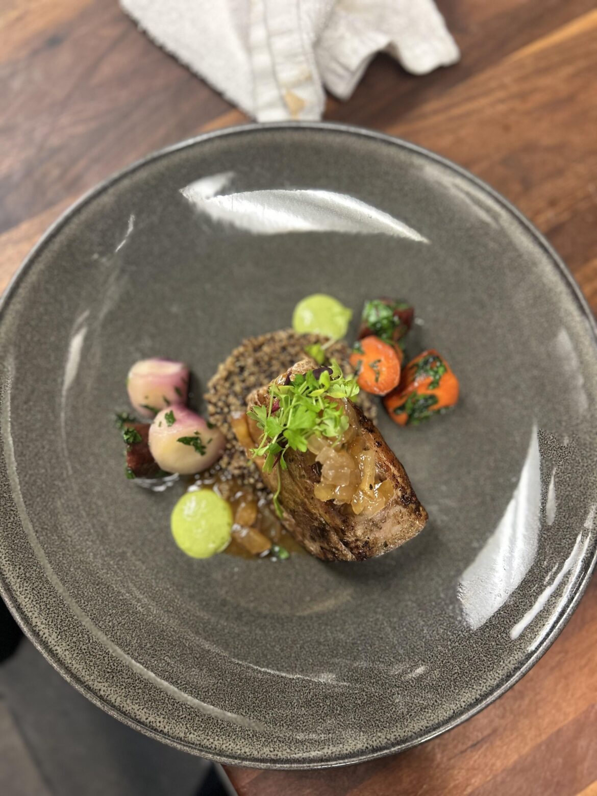 Pork Tenderloin, glazed Carrot, black garlic quinoa, apple relish, Verde (Ger) sauce, Mirepoix micro.