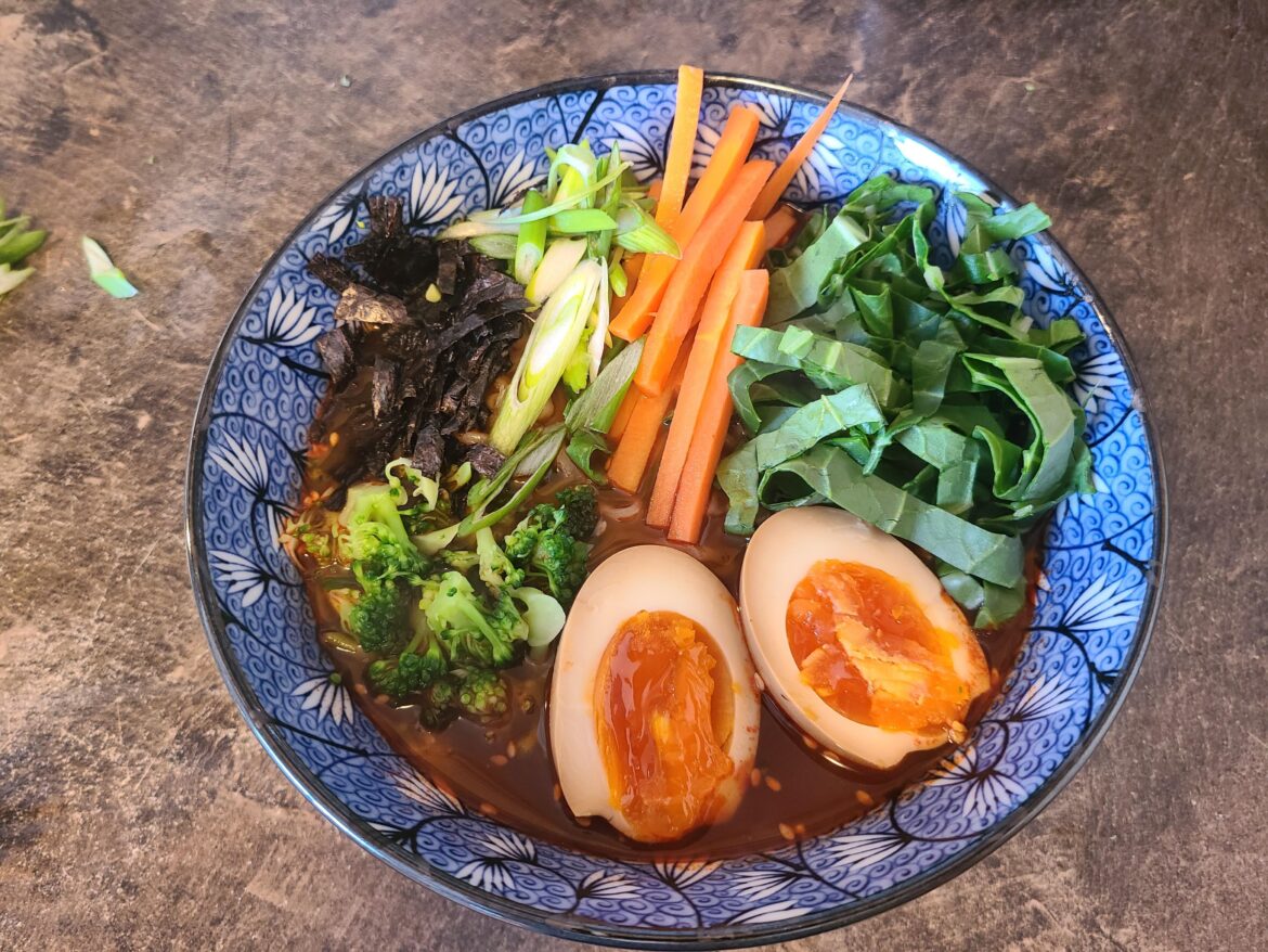 Buldak 2x made like soup with pickled carrot, bok choy, spicy soy marinated egg, broccoli, and nori