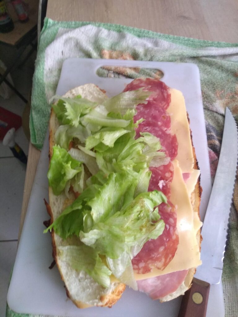 salami, cheese, giardinera, lettuce and homemade mustard on cheesy baguette