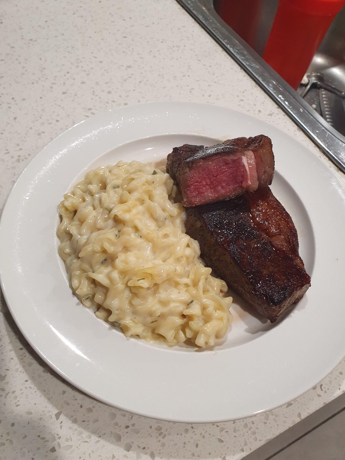 Porterhouse, pan seared with black garlic salt seasoning.